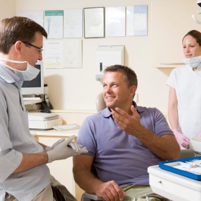 Patient consulting with dentist